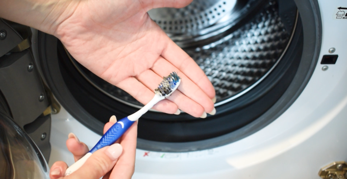 scrub the washing machine gasket