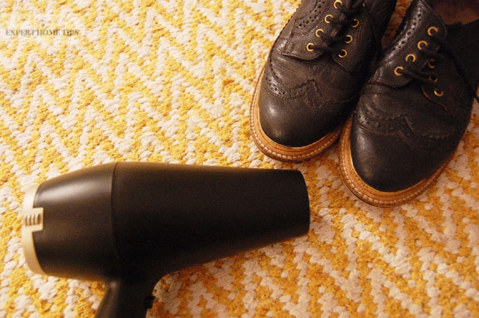 Loosen leather shoes with a hair dryer