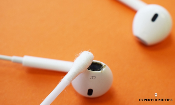 cleaning headphones with cotton bud