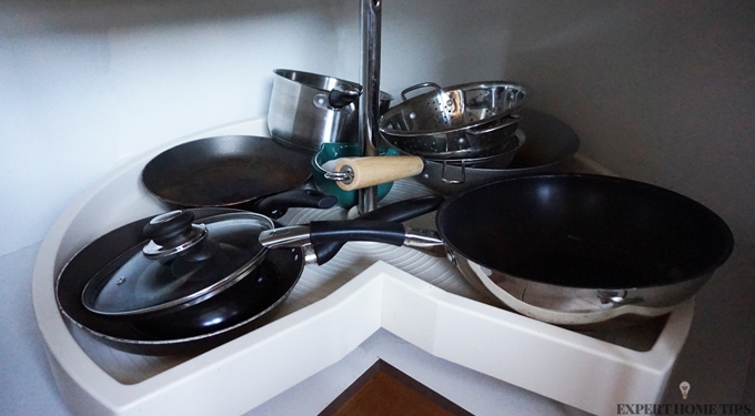 Pots and pans in cupboard