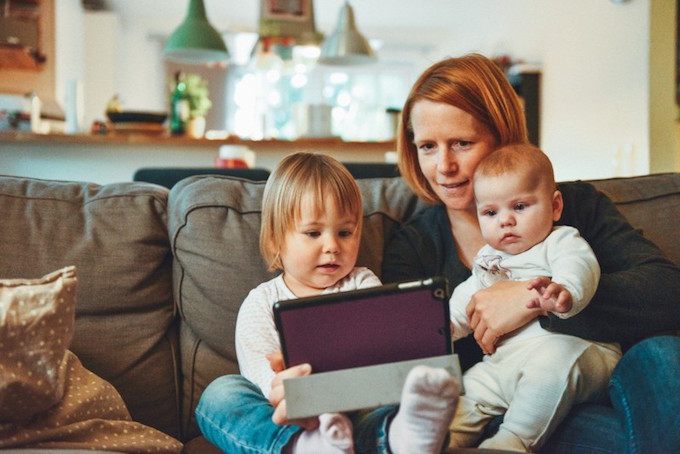 Mother and children using ipad