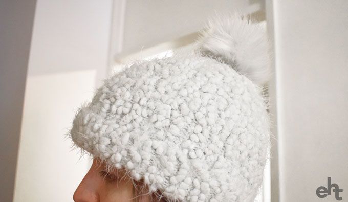 person wearing a bobble hat