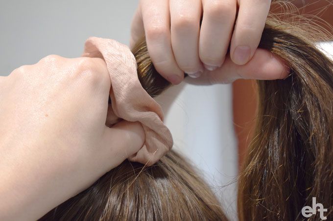 putting hair in a ponytail