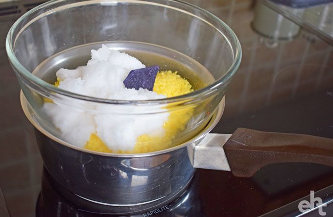 saucepan with beeswax, coconut oil and candle dye in